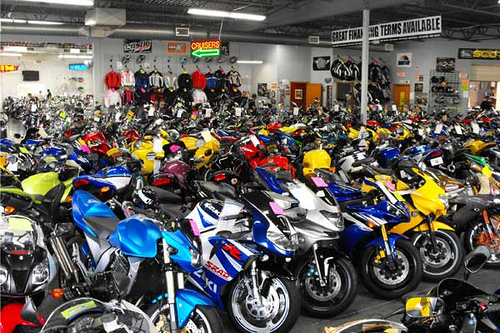 A new Kawasaki, Suzuki, Honda, Yamaha and Triumph in the first row.
