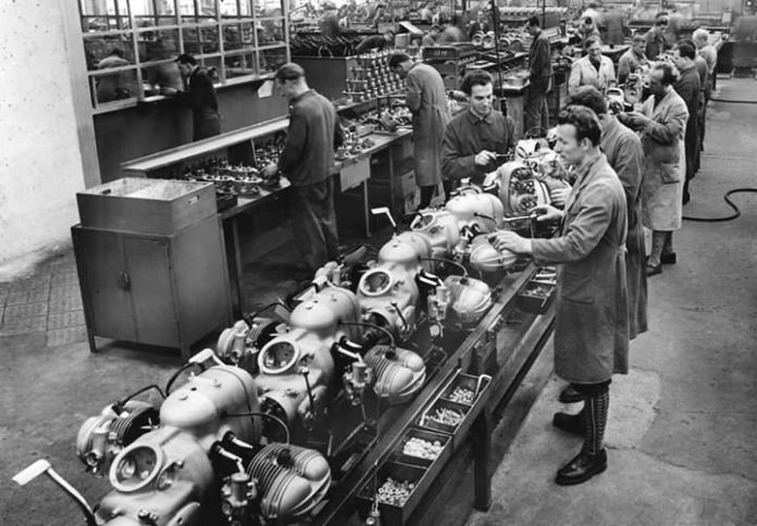 BMW Motorrad R1150 GS production line late last year. A place so relaxing, the man in the foreground is wearing knee-highs. 