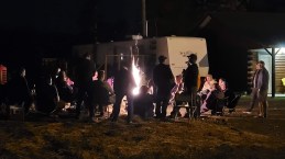 A late-night confab at the camper. All the cabins were booked, so many riders ended up camping for the weekend, just like in years past. Photo: Charles Landry