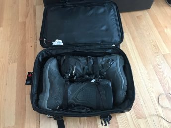 Inside the main bag, there's a lot of clothing stuffed into those boots. No fancy dinner jacket, though.