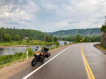 Motorcycle on Highway 129 beside Mississagi River in Algoma region, Ontario