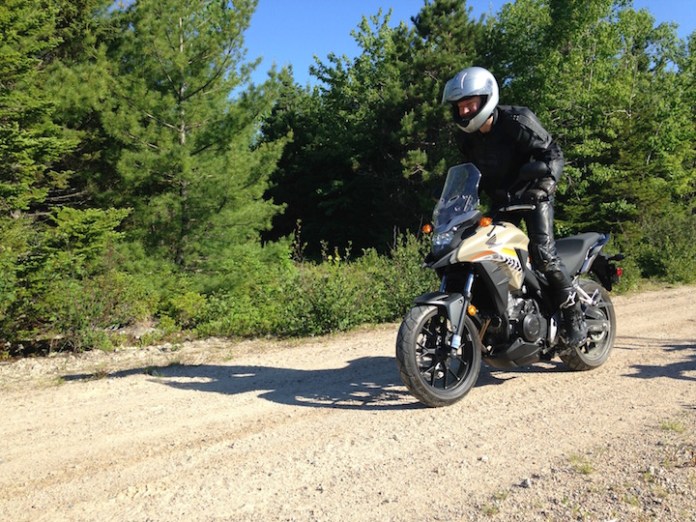 Coming to grips with a lack of grip. 200+ kgs of Honda handles pretty well on loose gravel.