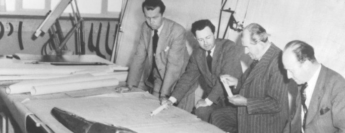 The design office at Porsche in the late 1950's was pretty typical of the era: large drafting tables for executing full-scale technical drawings, and lots of ash trays.